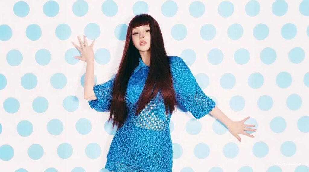 Yuqi from i-dle poses for Cosmopolitan China’s February 2026 cover in bold, high-fashion styling, showing her confidence as a Chinese K-pop star.