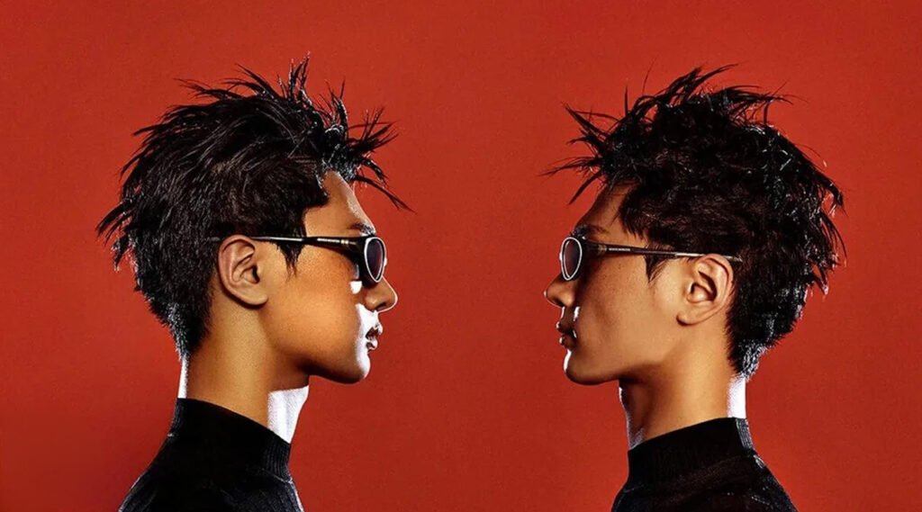 Jay ENHYPEN Circuit Speed GQ Korea x Gentle Monster. ENHYPEN Jay GQ Korea Gentle Monster April 2026 pictorial, spiky hair intense gaze black outfit white gloves F1-inspired eyewear.