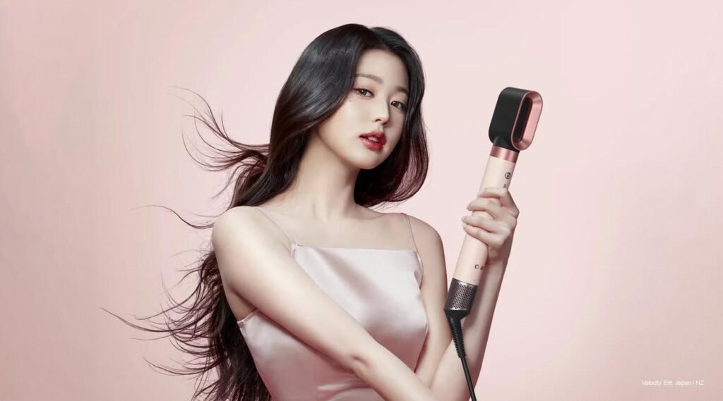 Jang Wonyoung of IVE posing for Dyson APAC hair device ambassador campaign in a polished fashion editorial setting.