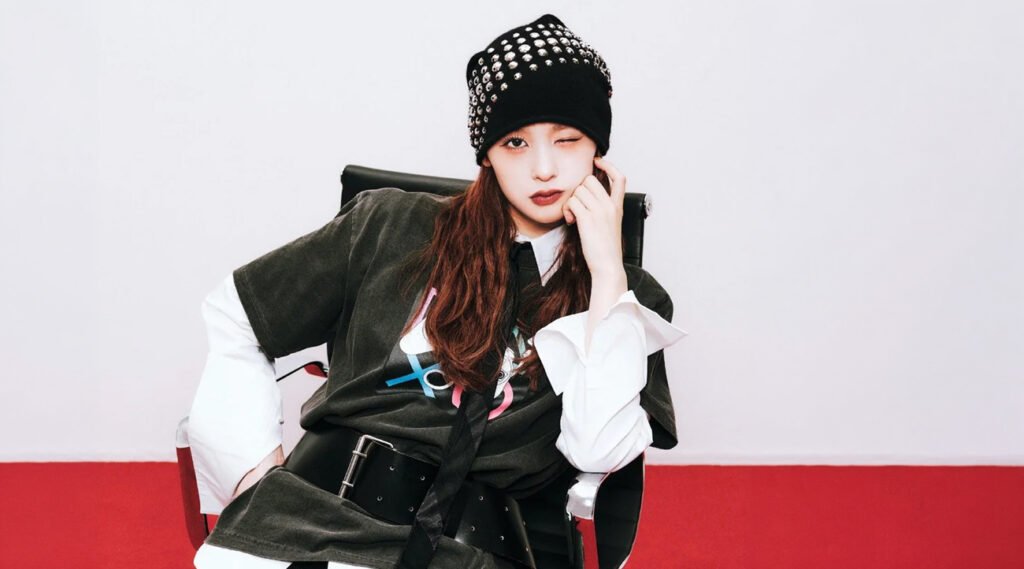 Japanese solo artist and former ME:I member Ran Ishii models two personas—User 1 in blue and User 2 in red—in the WIND AND SEA x PlayStation capsule collection, blending retro gaming nostalgia with modern streetwear.