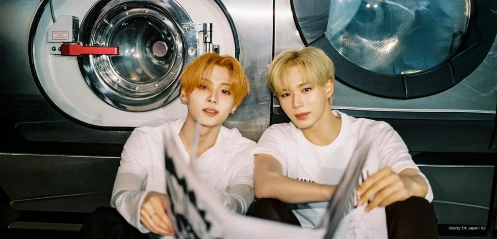ALPHA DRIVE ONE members in Laundromat concept photo for No School Tomorrow prologue single, retro styling, warm amber light