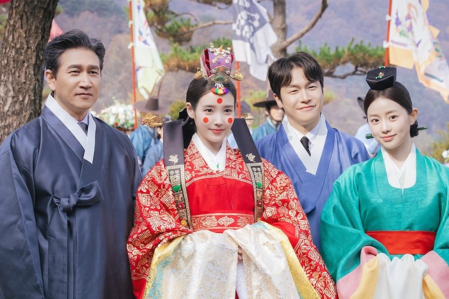 IU And Her Family Share A Rare Heartwarming Moment At Her Wedding To Byeon Woo Seok In Unreleased Stills For “Perfect Crown”