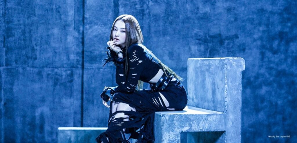 MEOVV teaser photo for BITE NOW showing the group’s dark fashion concept and cinematic styling.