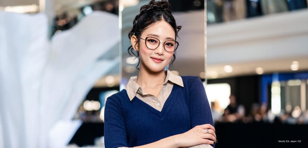 Minnie of i-dle wearing OWNDAYS PhotoShade Collection frames at the OWN "your" DAYS pop-up launch, Plaza Singapura, June 2026
