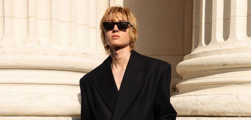 Martin and James at Saint Laurent SS27 Martin of CORTIS in a long black Saint Laurent look at the Paris show.