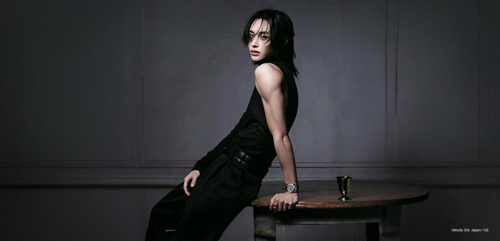 RIIZE Wonbin in a sleeveless black BVLGARI look, leaning against a marble table, for Marie Claire Korea 2026 Summer Edition