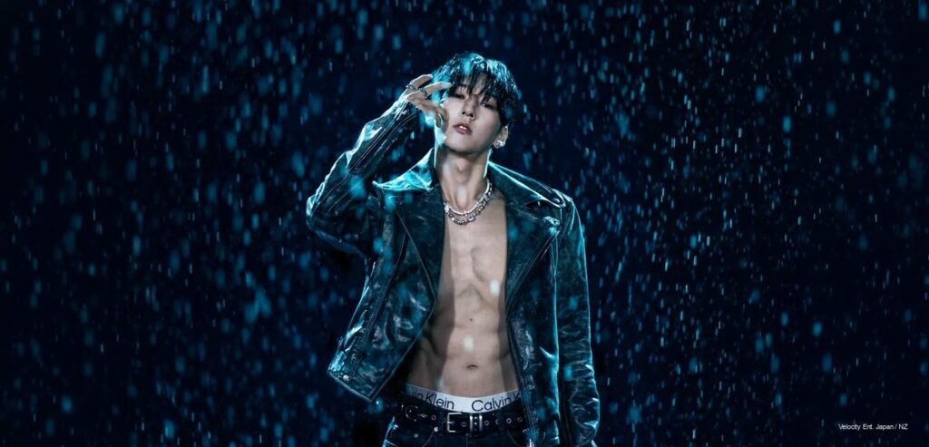 ALL'N in dark, rain-soaked teaser visuals for “Dream Higher,” wearing a sleek leather look with silver jewelry in a cinematic K-pop fashion editorial.