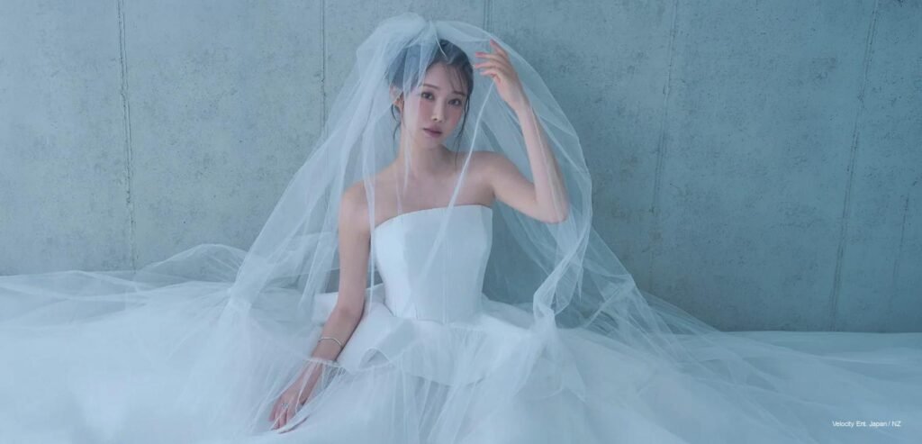 BBGIRLS Minyoung in a strapless white gown draped in sheer tulle veil for WEDDING H x BB de Blanc editorial