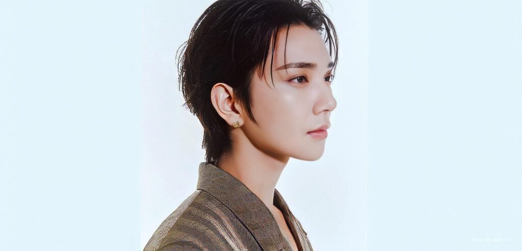 SEVENTEEN's Joshua Hong in profile wearing a bronze blazer and gold Chaumet earring for Numéro TOKYO September 2026 cover