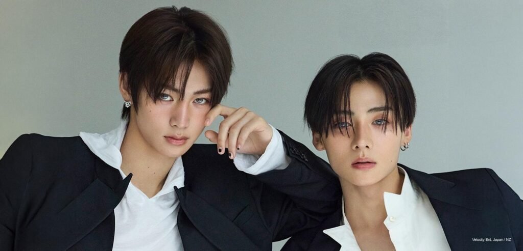 ALPHA DRIVE ONE members Sangwon and Anxin posing in tailored black suits for Super ELLE Korea October 2026 issue.
