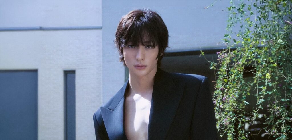 Anton of RIIZE posing for Esquire Korea October 2026 cover in a structured dark tailored blazer with an open chest aesthetic.