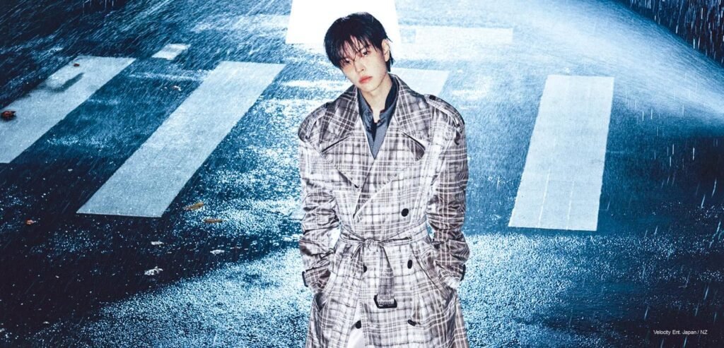 Seungmin DAZED Korea November | Kpoppie Stray Kids Seungmin wearing a Burberry plaid trench coat outdoors in the rain on a street crosswalk for DAZED Korea November 2026 cover story.