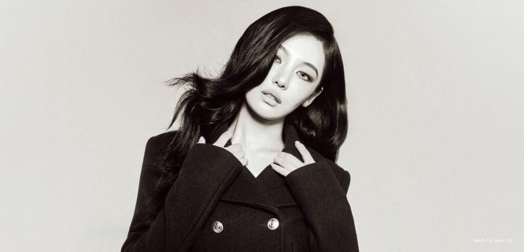aespa Ningning posing in a high-contrast monochrome Gucci coat for W Korea November 2026 issue.